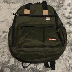 Skip hop backpack diaper bag with changing pad and stroller straps.